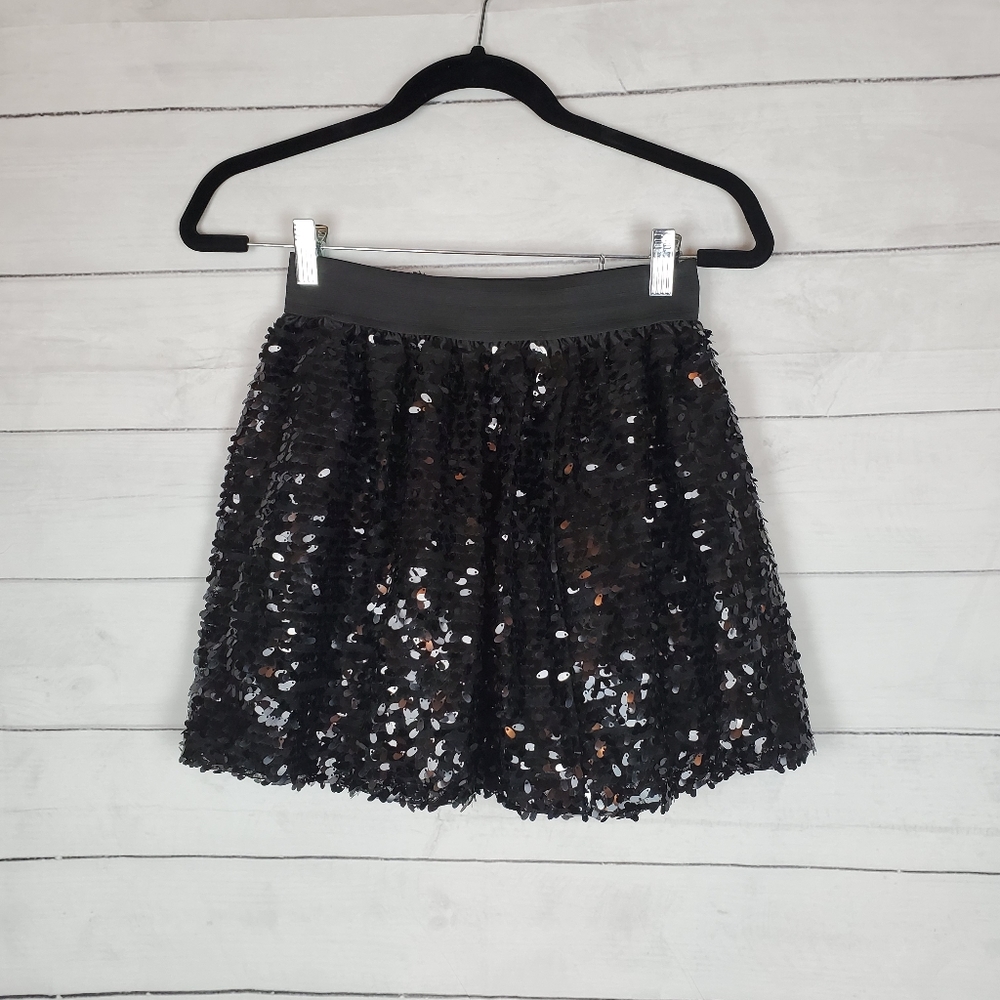 Children place black sparkle skirt